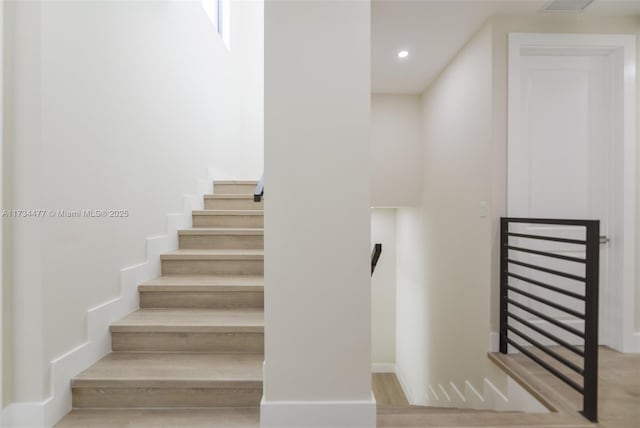 1617 NE 11th St Unit 1, Fort Lauderdale, FL 33304 - stairway with recessed lighting, baseboards, and wood finished floors