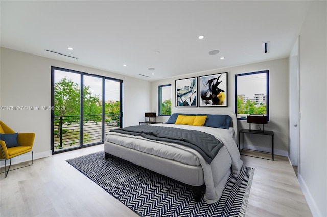 1617 NE 11th St Unit 1, Fort Lauderdale, FL 33304 - bedroom with light wood finished floors, access to exterior, baseboards, and recessed lighting