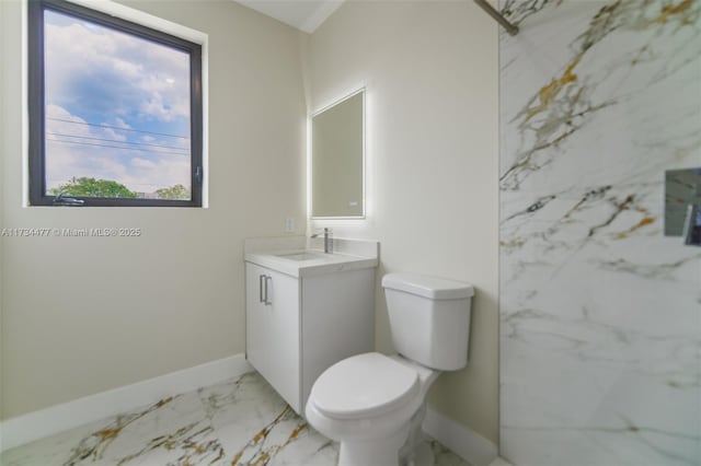 1617 NE 11th St Unit 1, Fort Lauderdale, FL 33304 - bathroom featuring marble look tile flooring, vanity, toilet, and baseboards