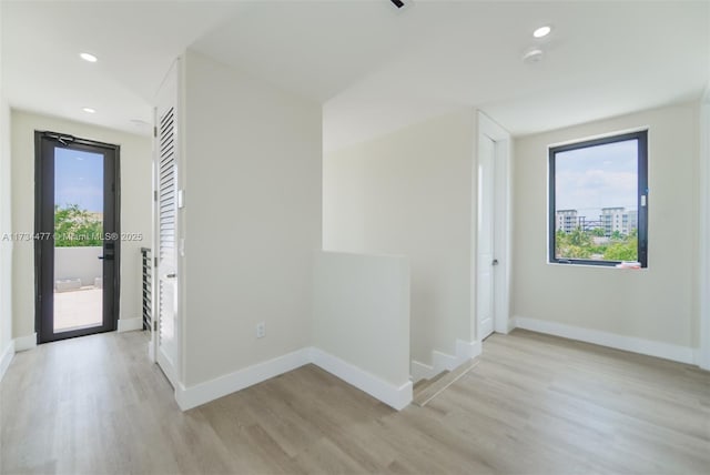 1617 NE 11th St Unit 1, Fort Lauderdale, FL 33304 - unfurnished room with light wood-style floors, baseboards, a smoke detector, and recessed lighting