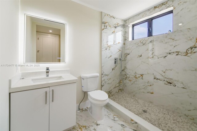 1617 NE 11th St Unit 1, Fort Lauderdale, FL 33304 - bathroom featuring vanity, toilet, a marble finish shower, baseboards, and marble finish floors