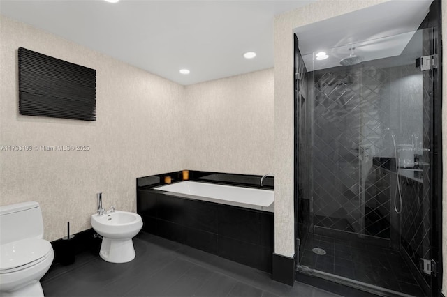 bathroom with a bidet, tile patterned floors, toilet, and separate shower and tub