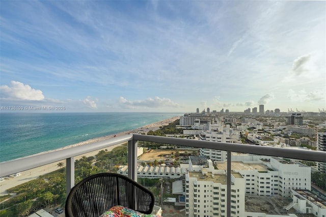 exterior space with a water view and a view of the beach