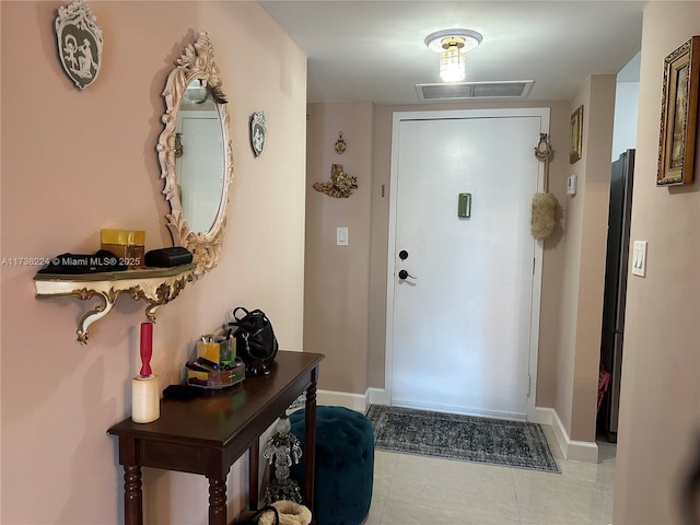 doorway featuring light tile patterned floors