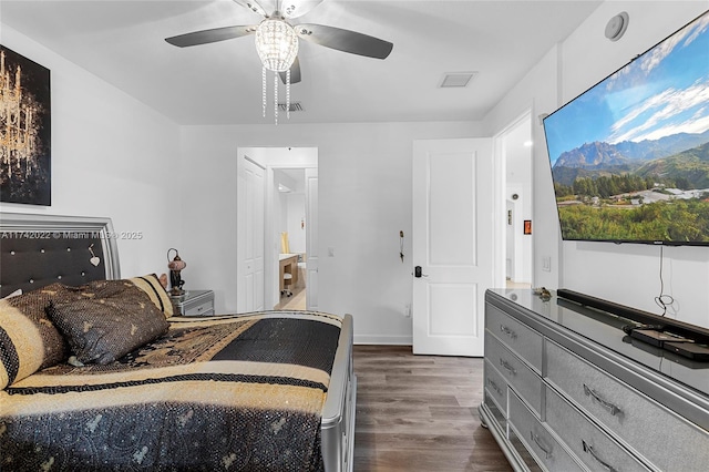 bedroom with dark hardwood / wood-style floors and ceiling fan