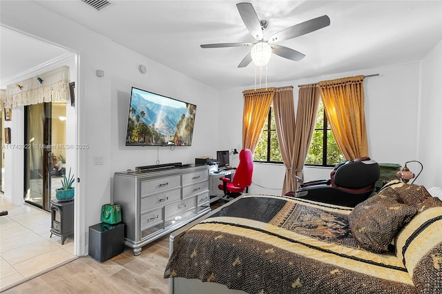 bedroom with ceiling fan and light hardwood / wood-style floors