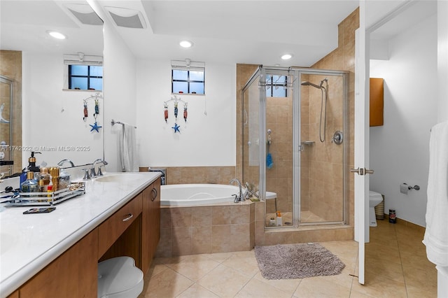 full bathroom with tile patterned flooring, vanity, separate shower and tub, and toilet