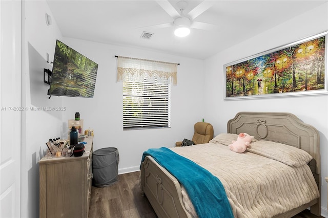 bedroom featuring ceiling fan and dark hardwood / wood-style floors