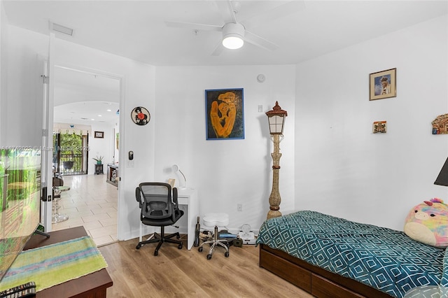 bedroom featuring ceiling fan and light wood-type flooring