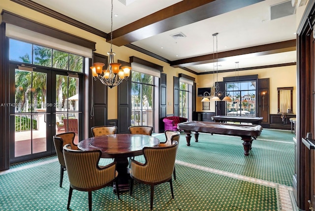 carpeted dining space featuring crown molding, beam ceiling, a chandelier, and french doors