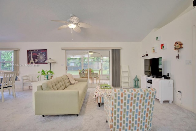 living room with light colored carpet and ceiling fan