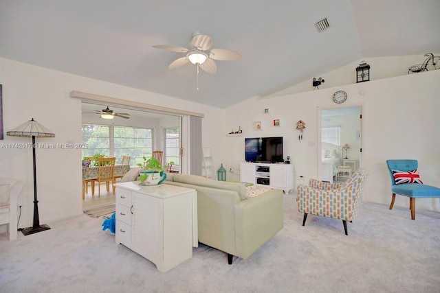 carpeted living room with vaulted ceiling and ceiling fan