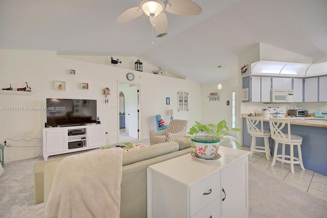 carpeted living room featuring ceiling fan, lofted ceiling, and a textured ceiling