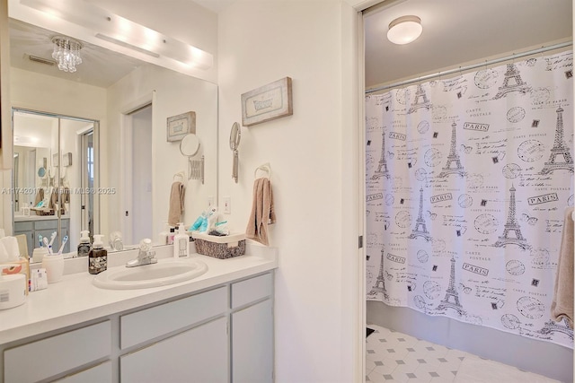 bathroom with vanity and shower / bath combination with curtain