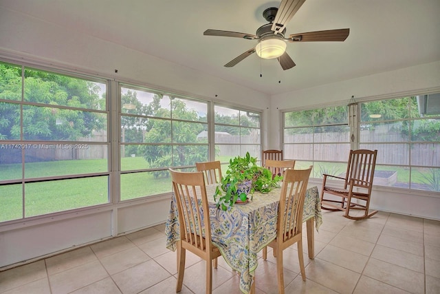 sunroom with a wealth of natural light and ceiling fan