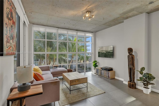 living room with expansive windows and plenty of natural light