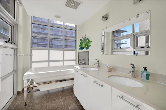 bathroom with vanity and tile patterned flooring