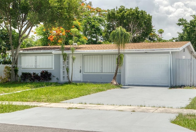 658 SW 1st Ct, Boynton Beach, FL 33426 - single story home with a garage, concrete driveway, a front yard, and stucco siding