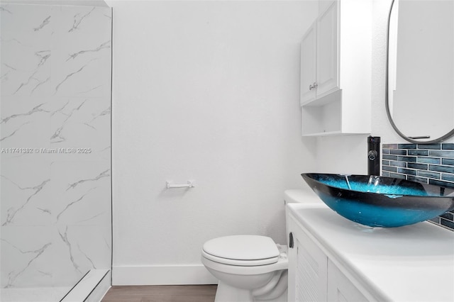 658 SW 1st Ct, Boynton Beach, FL 33426 - bathroom featuring vanity and wood finished floors