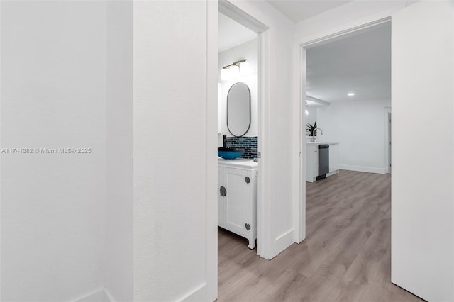 658 SW 1st Ct, Boynton Beach, FL 33426 - corridor with light wood-style flooring and baseboards