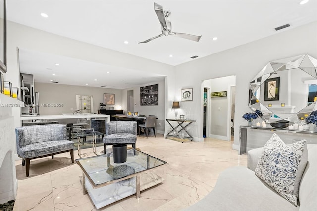 living room featuring ceiling fan