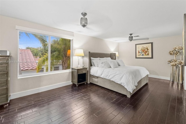 bedroom featuring dark hardwood / wood-style floors and ceiling fan