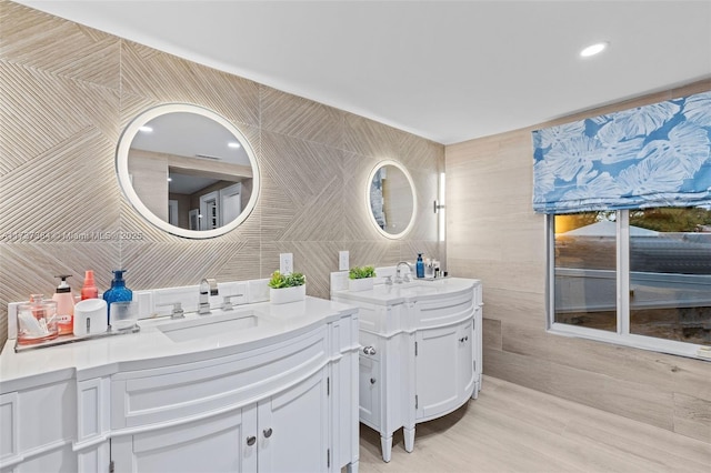 bathroom featuring tile walls, vanity, and decorative backsplash