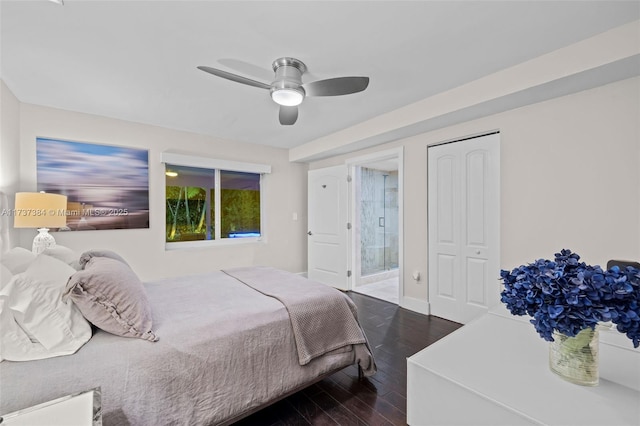 bedroom with hardwood / wood-style flooring, ceiling fan, and connected bathroom