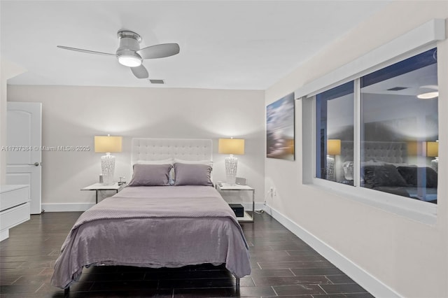 bedroom with dark hardwood / wood-style floors and ceiling fan