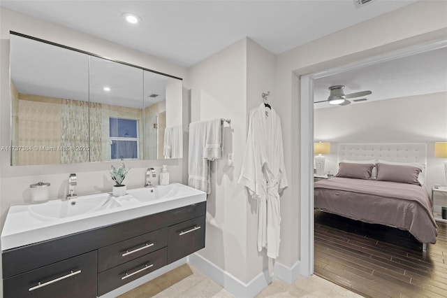 bathroom featuring hardwood / wood-style flooring, vanity, and ceiling fan