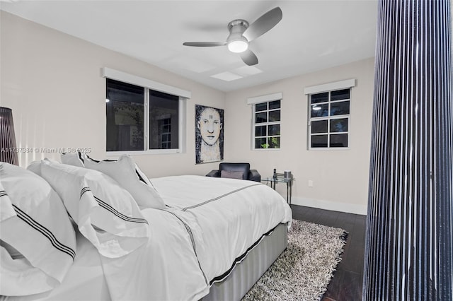 bedroom with dark wood-type flooring and ceiling fan