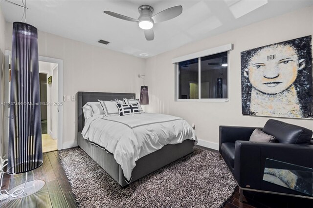 bedroom with hardwood / wood-style flooring and ceiling fan