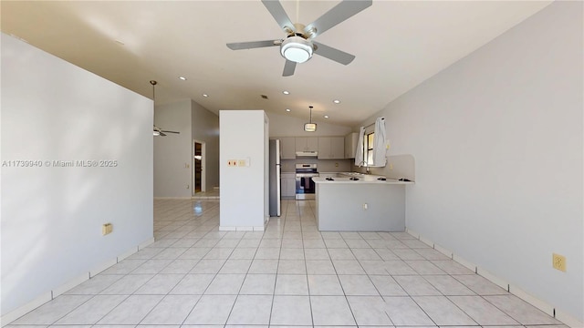 kitchen with light tile patterned floors, ceiling fan, appliances with stainless steel finishes, white cabinets, and kitchen peninsula