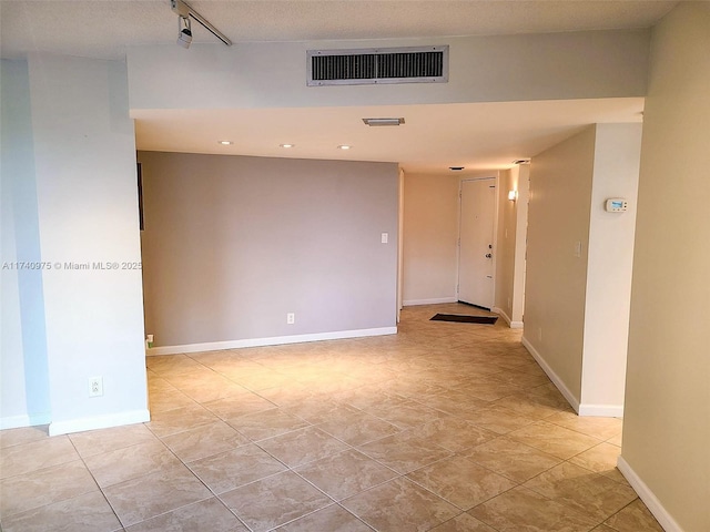 unfurnished room featuring visible vents, baseboards, and recessed lighting