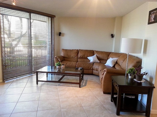 living area featuring light tile patterned floors