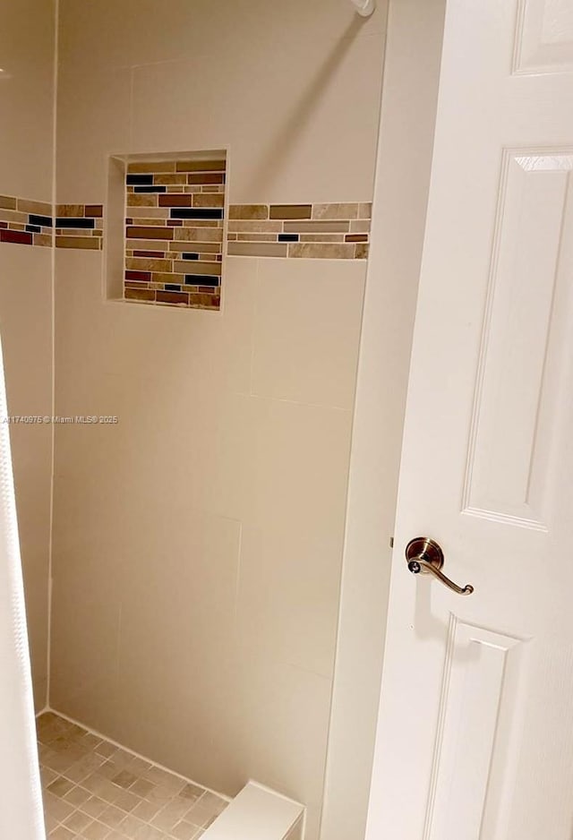 bathroom with tile walls