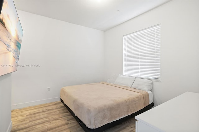 bedroom featuring hardwood / wood-style floors