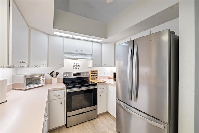 kitchen with white cabinetry, appliances with stainless steel finishes, and light wood-type flooring