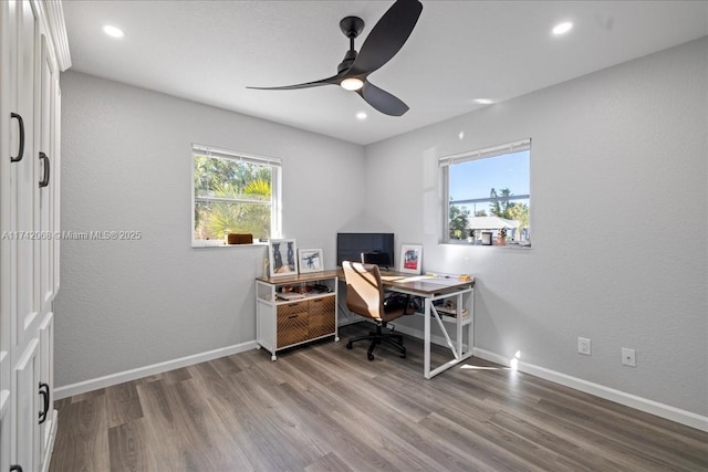 office area with ceiling fan and wood-type flooring