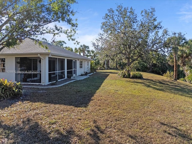 view of yard with a sunroom