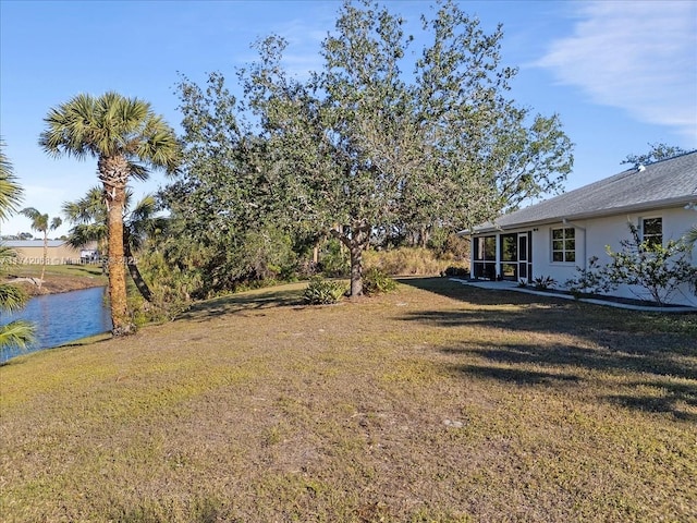 view of yard with a water view