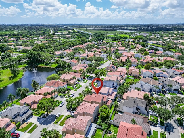 aerial view featuring a residential view and a water view