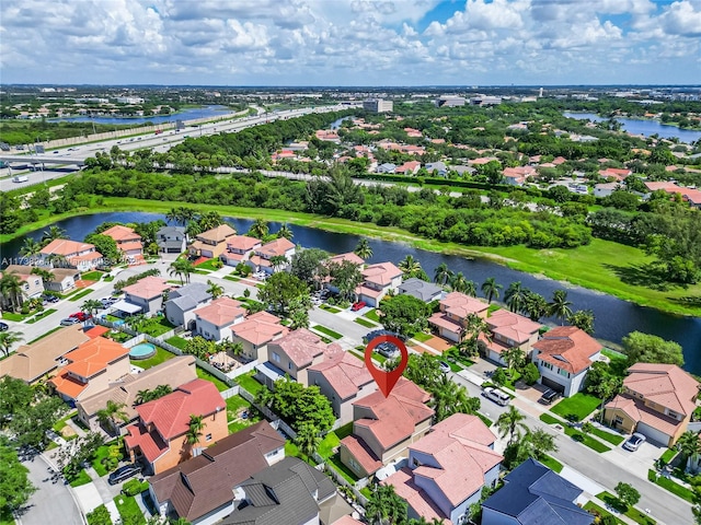 aerial view with a residential view and a water view