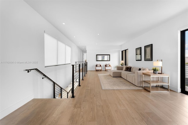 living room with a healthy amount of sunlight and light wood-type flooring