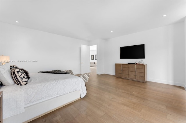 bedroom with light hardwood / wood-style floors