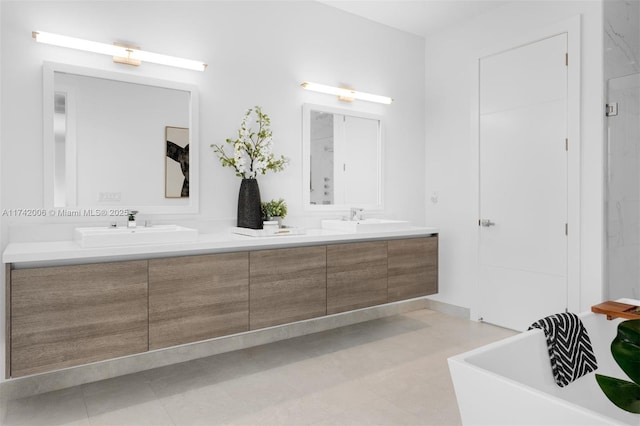 bathroom with a tub to relax in and vanity