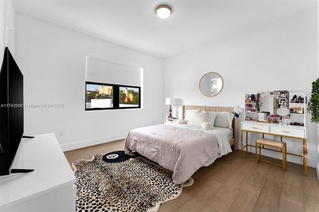 bedroom featuring hardwood / wood-style flooring