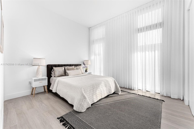 bedroom with light wood-type flooring