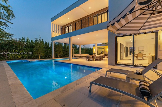 view of pool featuring a patio area