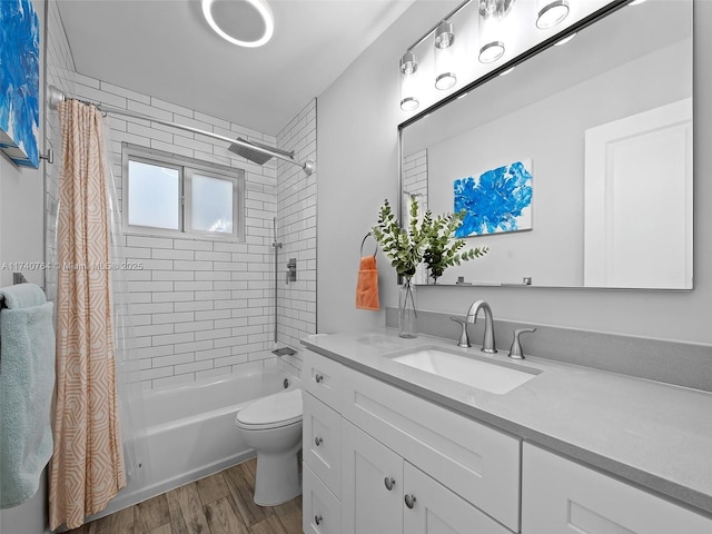 full bathroom with vanity, wood-type flooring, toilet, and shower / bath combo